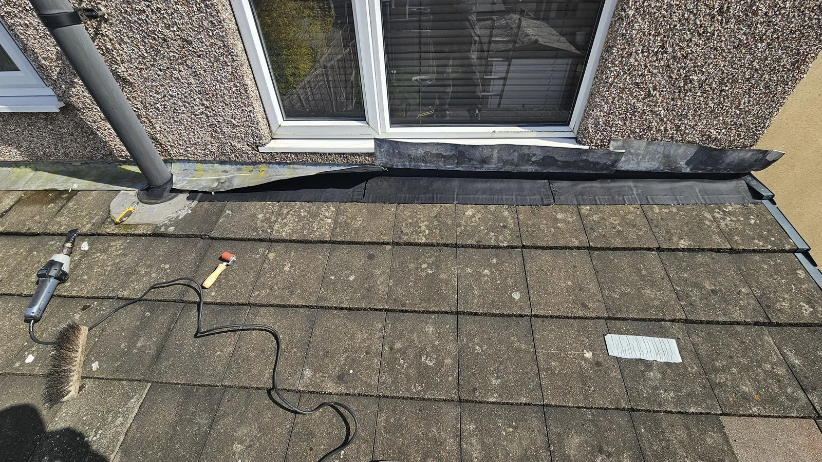 Repaired roof section