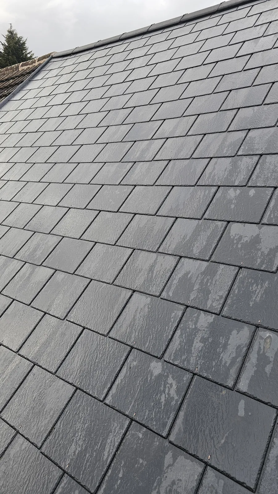 Slate roof being fitted by BM Roofing Specialist