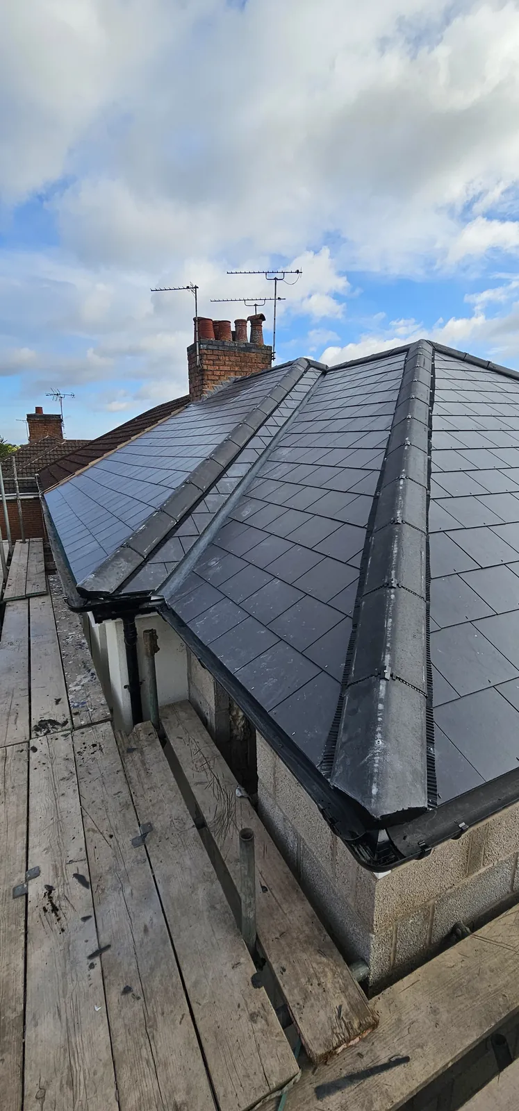 New ridge tiles bedded and pointed
