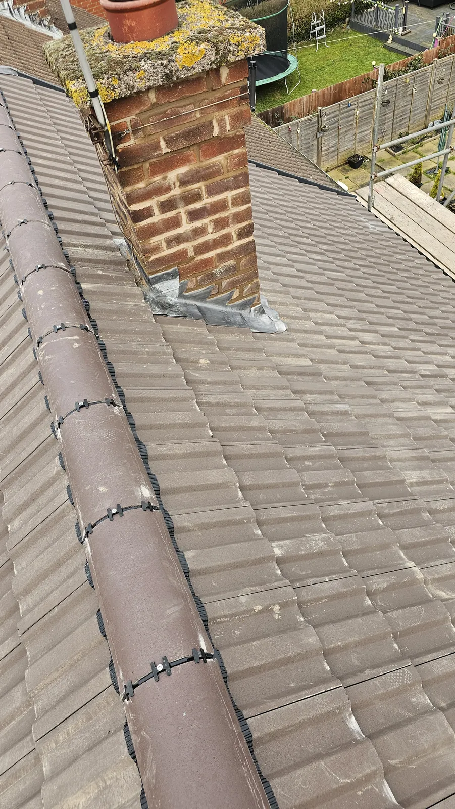 Roofing team fitting new tiles